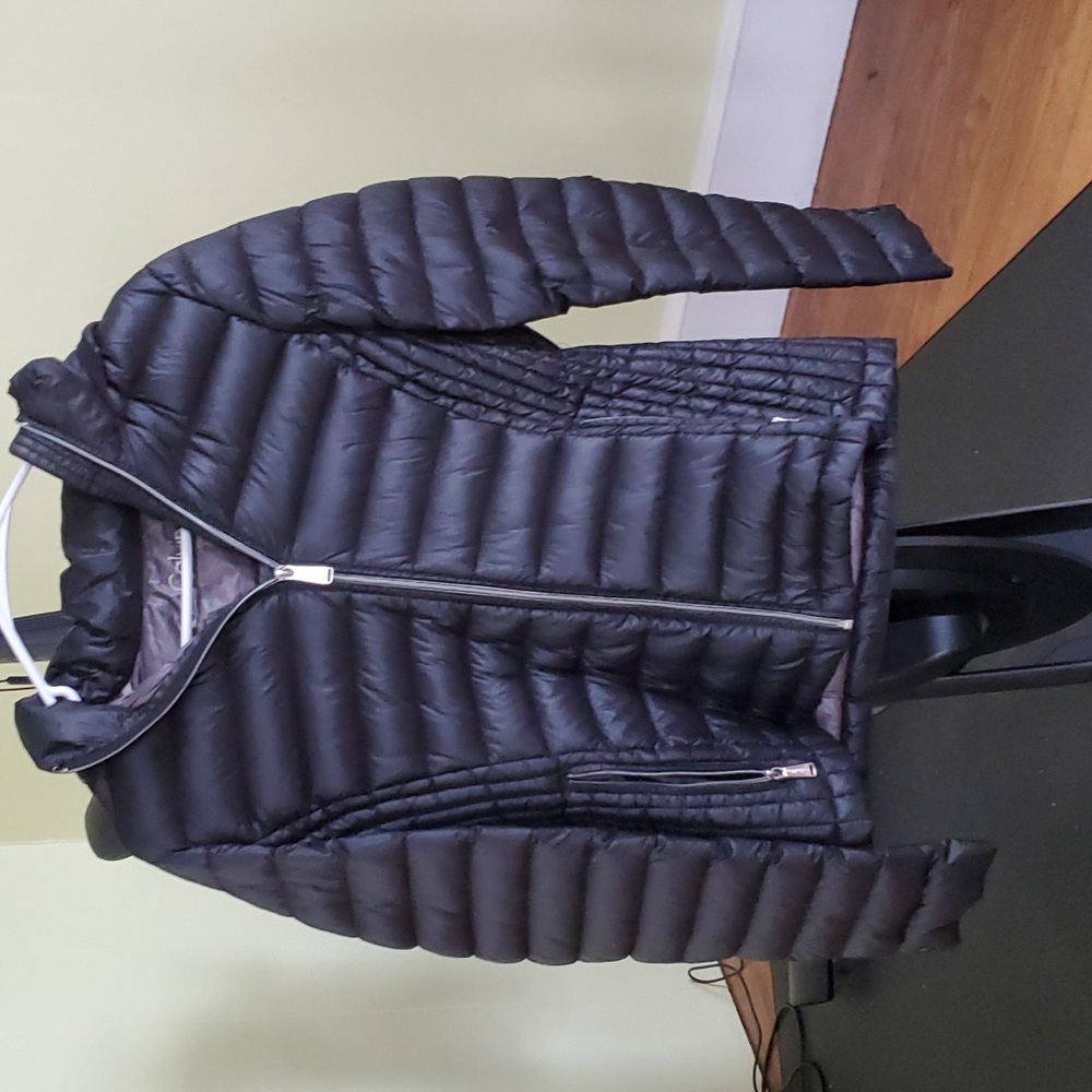 Girls black Calvin Klein packable lightweight premium down jacket.  (M)
